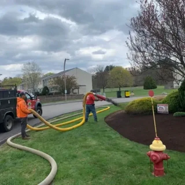 Crew hydroseeding a lawn