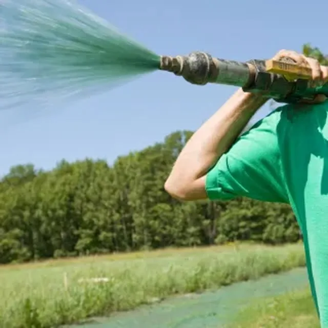 Watering a newly seeded lawn